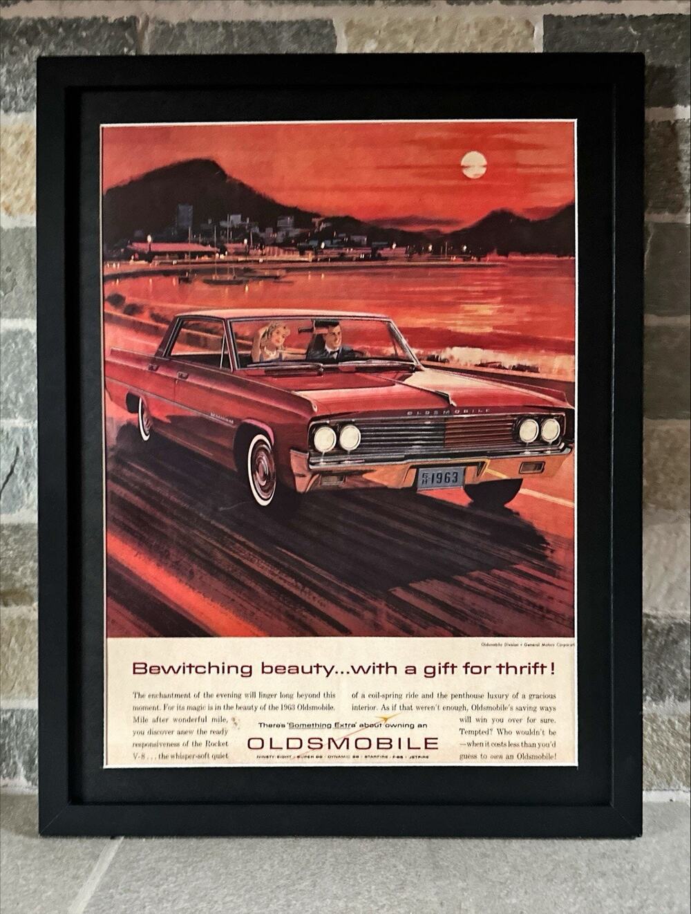 Framed 1963 Oldsmobile Rocket V-8 at Sunset Vintage Original Print Ad Wall Art